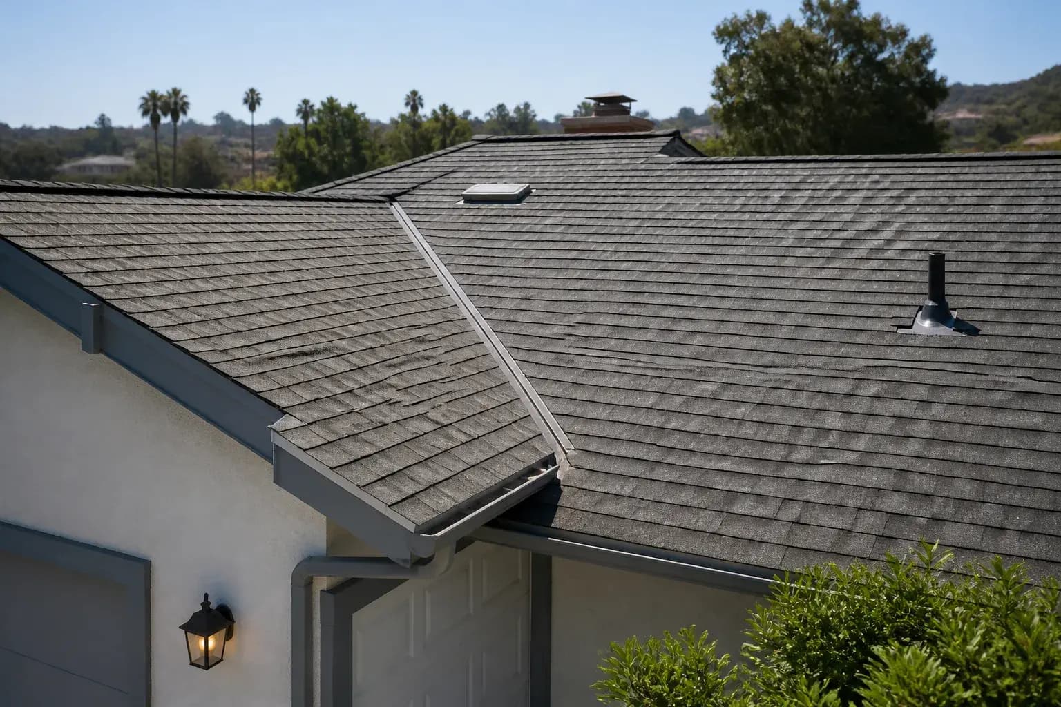 Well-maintained roof with clean valleys and gutters.