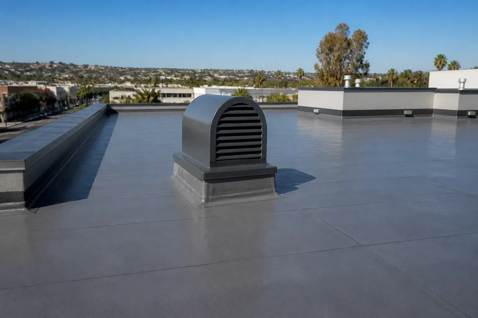 Finished flat roof with smooth membrane and clean seams.