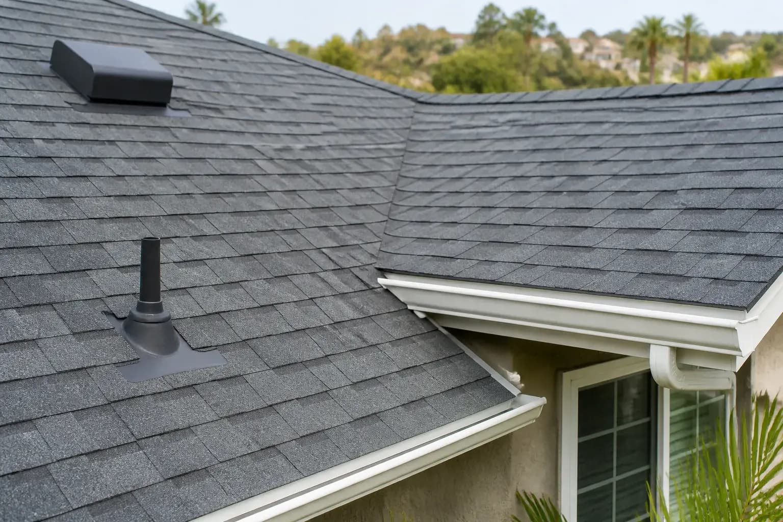 Maintained roof section with clean valleys and gutters.